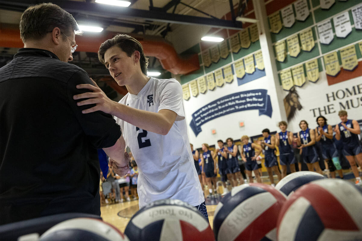 Shadow Ridge senior Justin Lewis accepts his medal after winning the Class 5A boys volleyball s ...