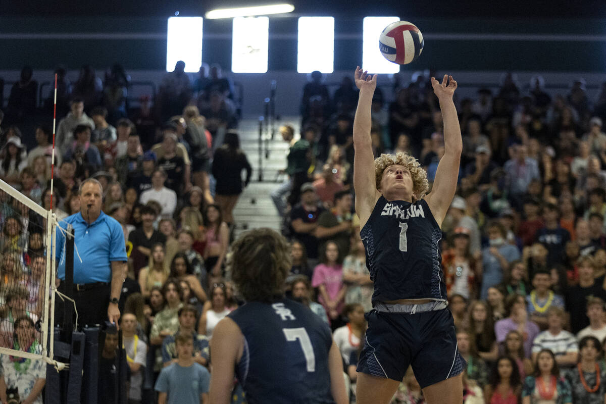 Shadow Ridge setter Noah Barrus sets to middle blocker Tyler Kirk (7) during the Class 5A boys ...