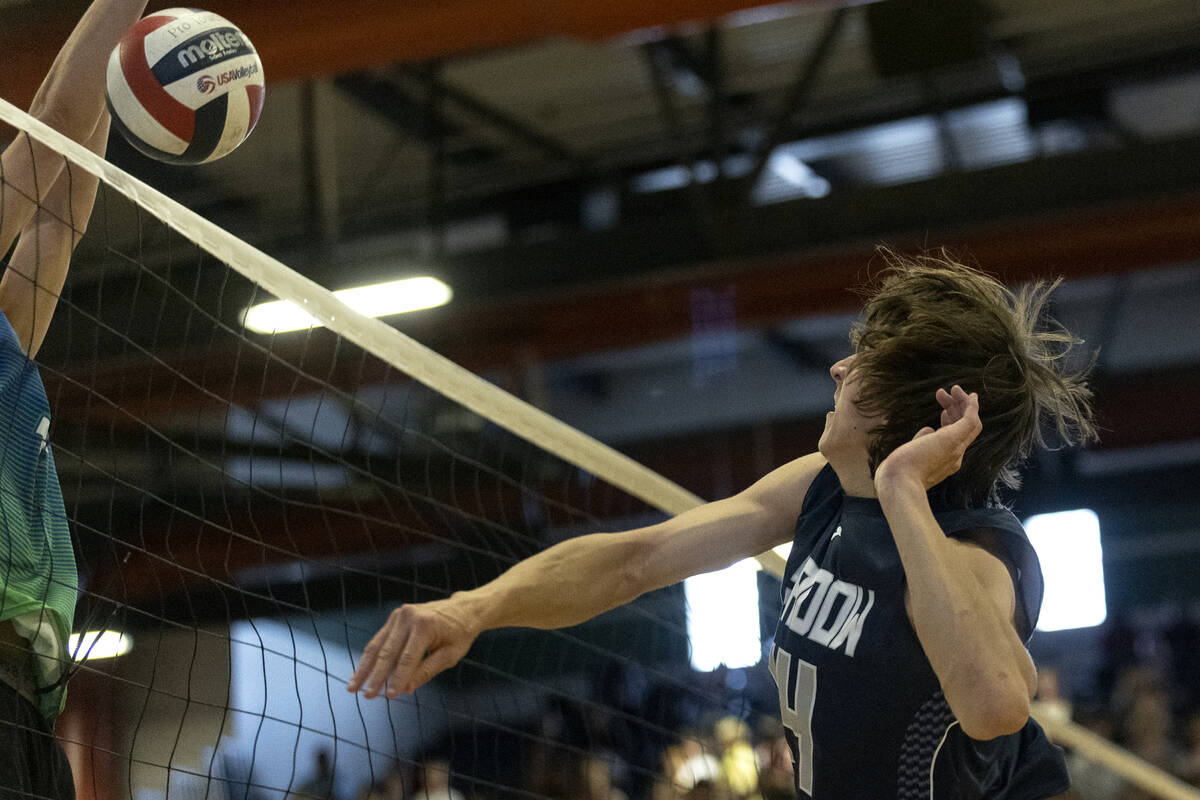 Shadow Ridge’s Brady Beko (14) spikes to Green Valley during the Class 5A boys volleybal ...