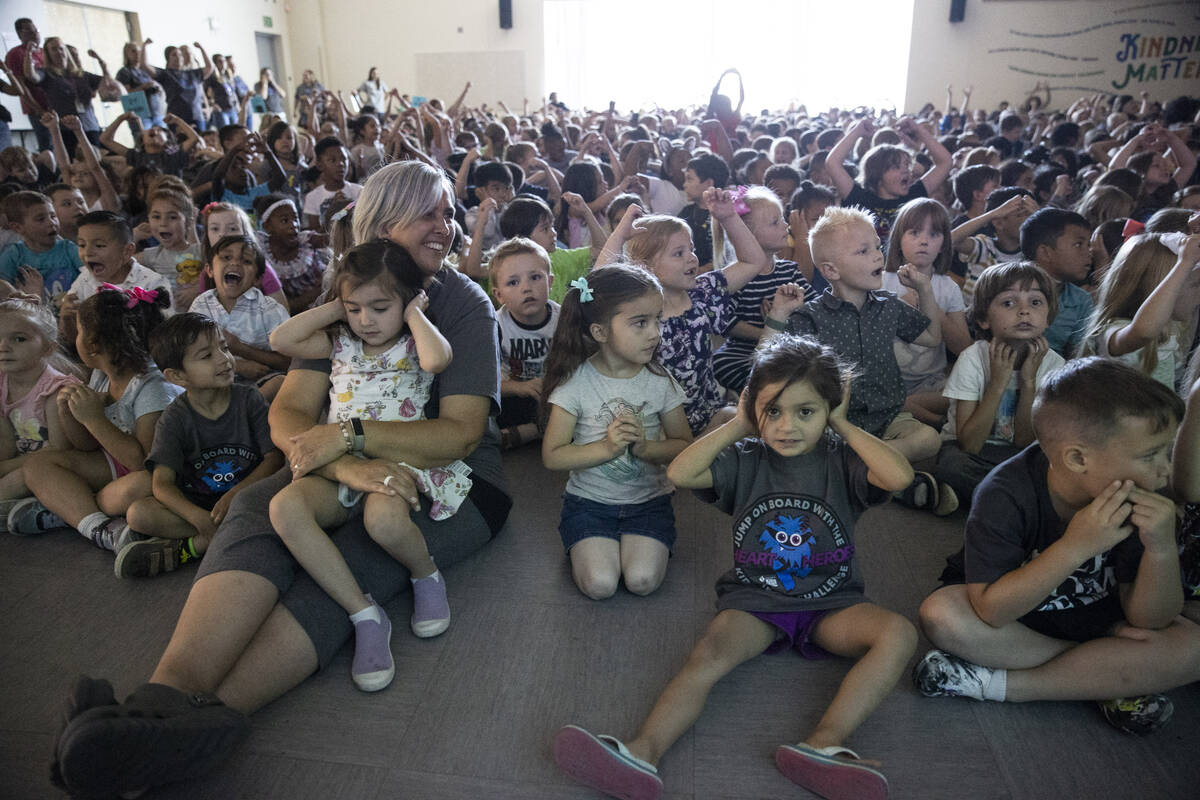 Students and faculty participate during a ceremony at Divich Elementary School in Las Vegas, wh ...