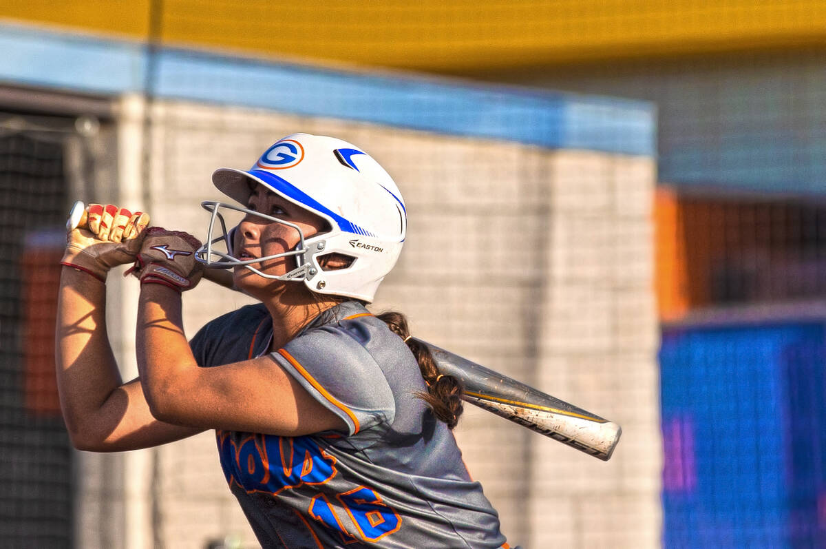 Bishop Gorman’s Kayla Acres (16) drives a pitch during a Class 4A state softball tournam ...