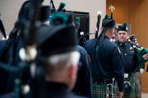 Jason Bressler, right, a Metropolitan Police Department officer and and pipe major for the Las ...