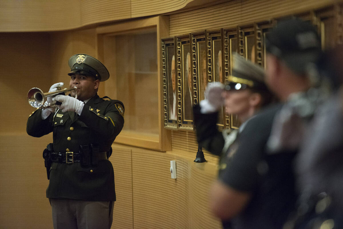 Officer Victor Noriega performs Taps during the Southern Nevada Law Enforcement Memorial in Cit ...