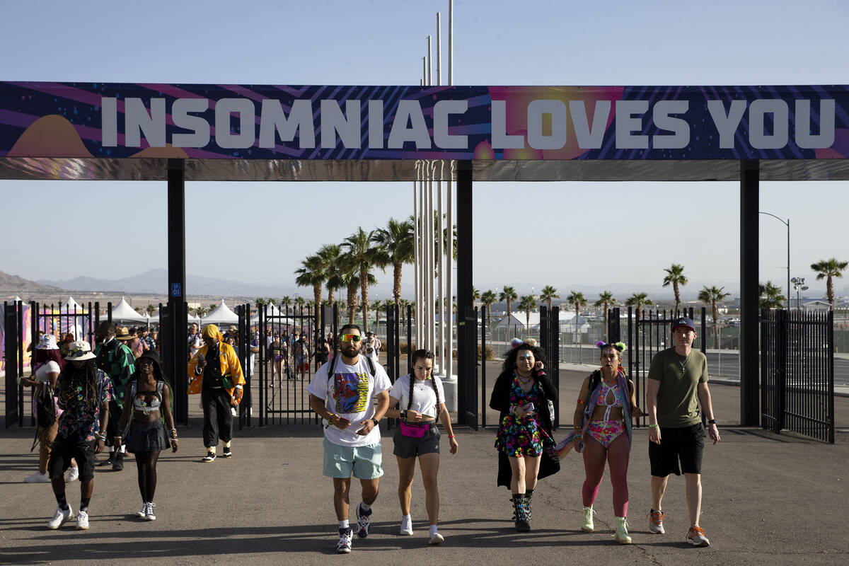 Attendees enter the festival grounds during the first day of the Electric Daisy Carnival at the ...