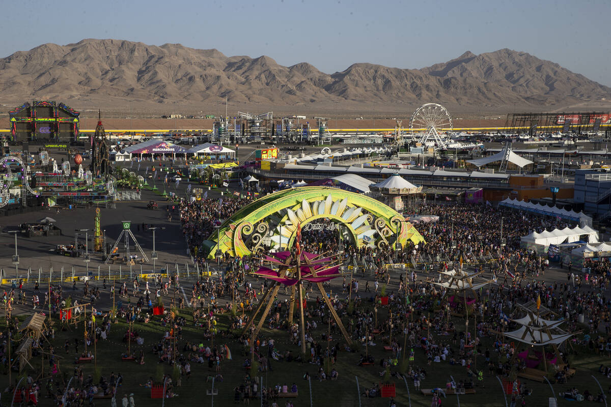 Festival-goers wait for the full grounds to open during the first day of the Electric Daisy Car ...