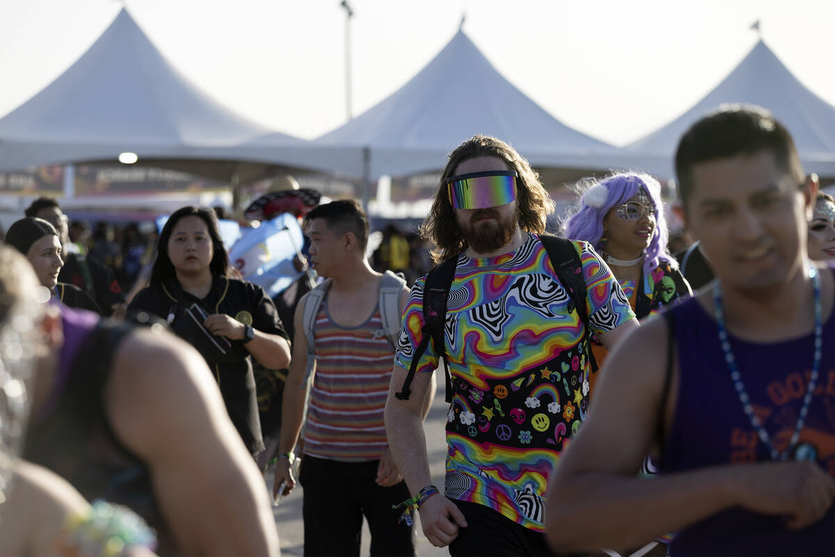 Attendees enter the festival grounds during the first day of the Electric Daisy Carnival at the ...