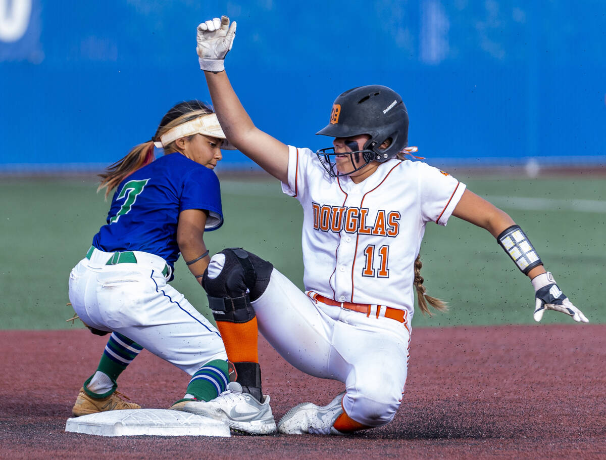 Douglas runner Zora Simpson (11) is safe at second base as Green Valley infielder Cindy Martine ...