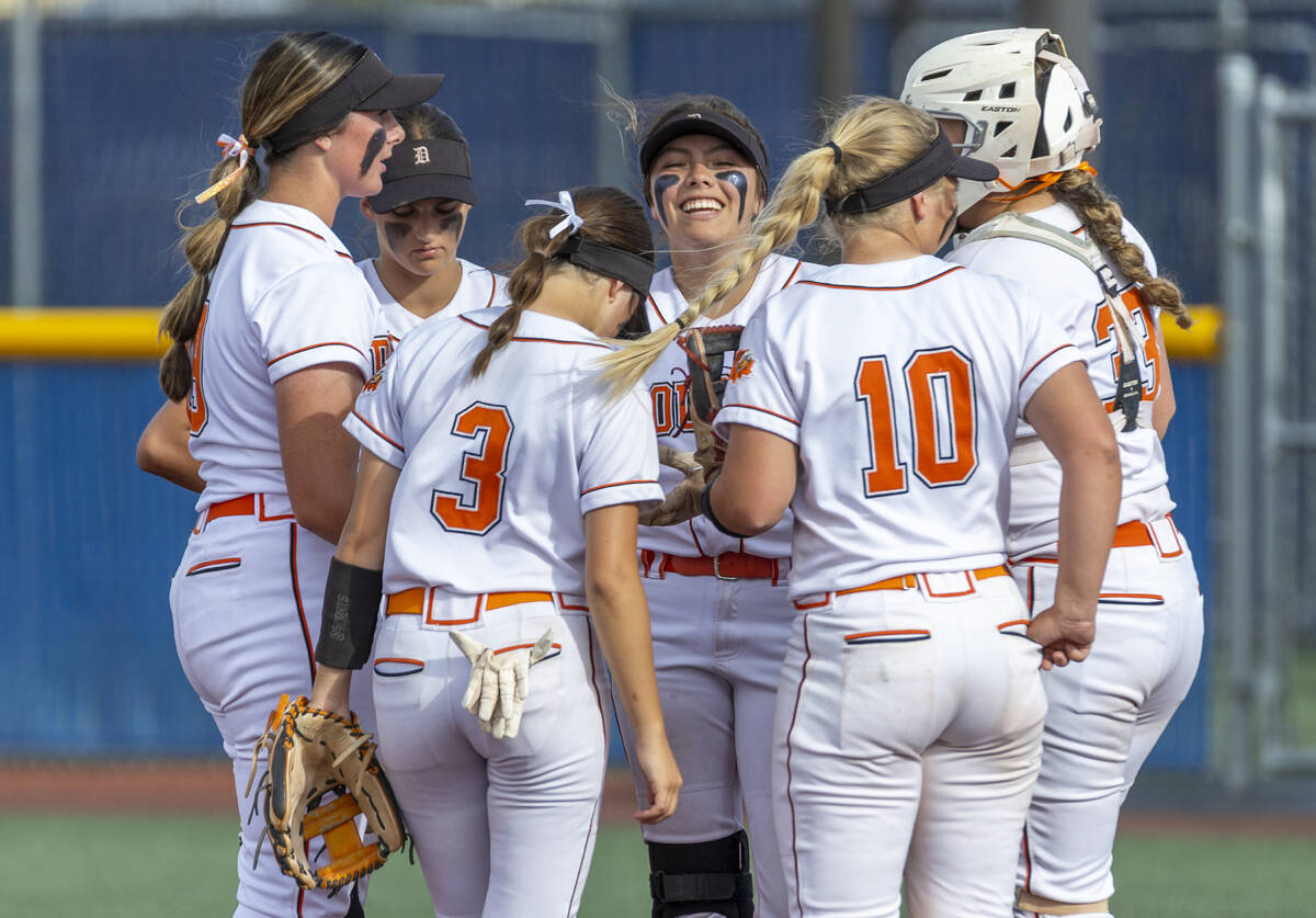 Douglas players chat on the mound during a timeout versus Green Valley during their Class 5A st ...