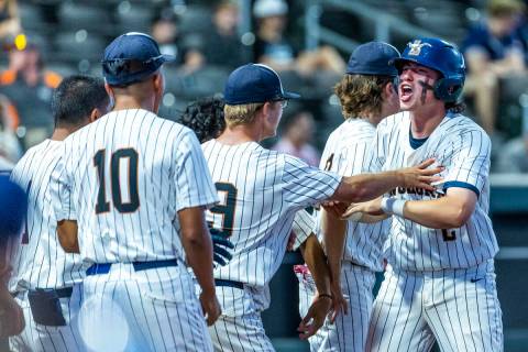 Legacy runner Oscar Pena (2) celebrates another score with teammates against Shadow Ridge durin ...