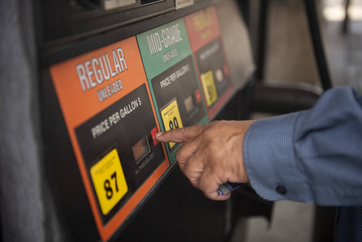 Phil Carrillo, of Las Vegas, pumps gas at a 7-Eleven station on Washington Avenue on Thursday, ...