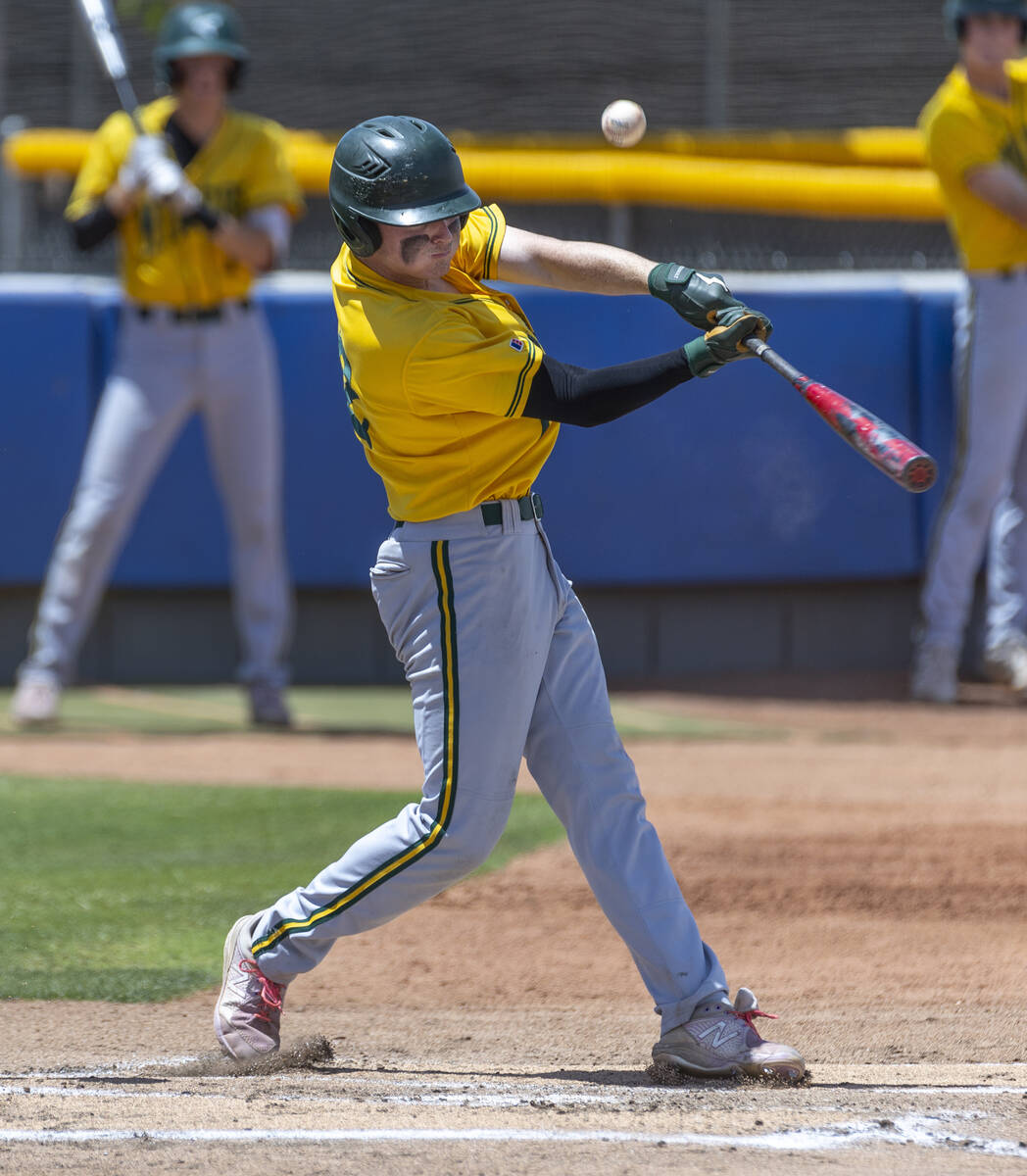 Bishop Manogue batter Sam Kane (22) gets a hit versus Basic during their Class 5A state basebal ...
