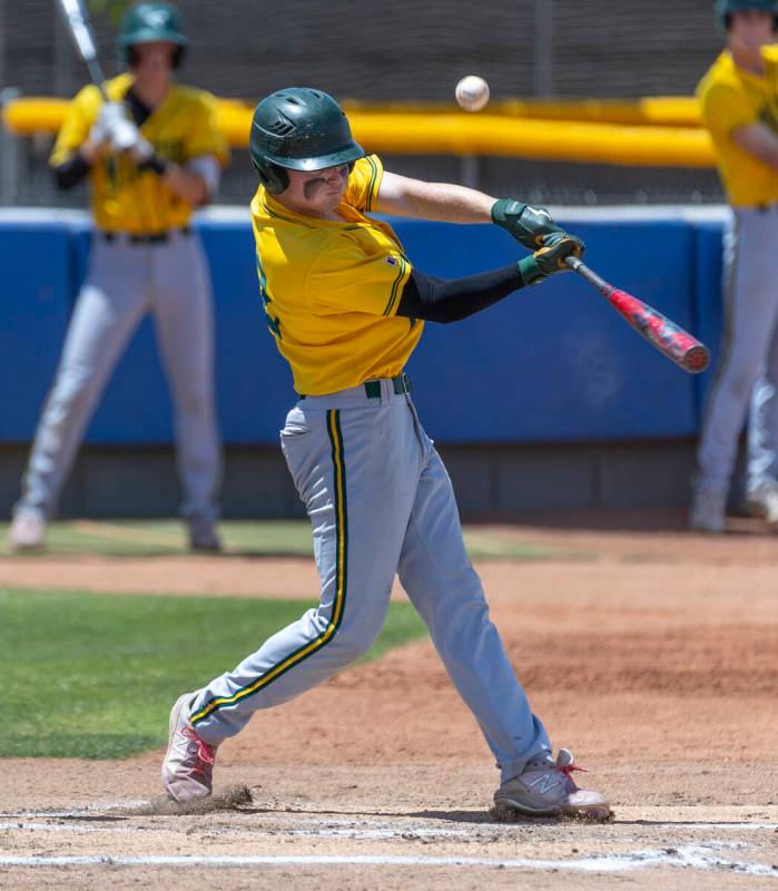 Bishop Manogue batter Sam Kane (22) gets a hit versus Basic during their Class 5A state basebal ...