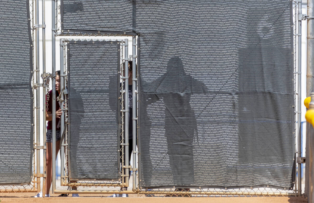 Girls watch from deep behind right field as Basic battles Bishop Manogue during their Class 5A ...