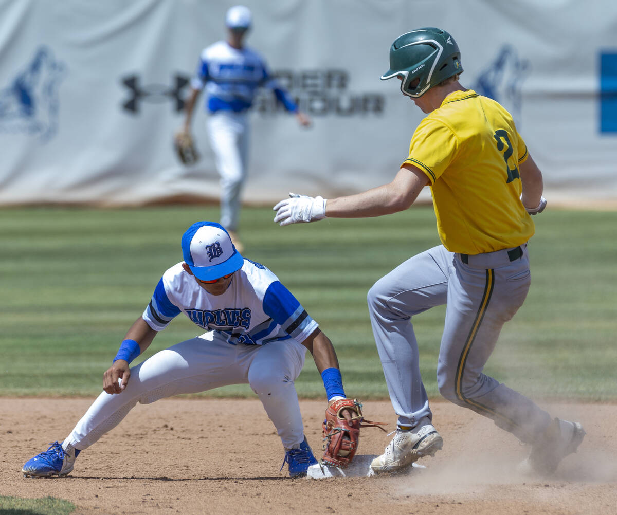 Basic short stop Ty Southisene (3) makes a tag late as Bishop Manogue runner Joey Scolari (2) a ...