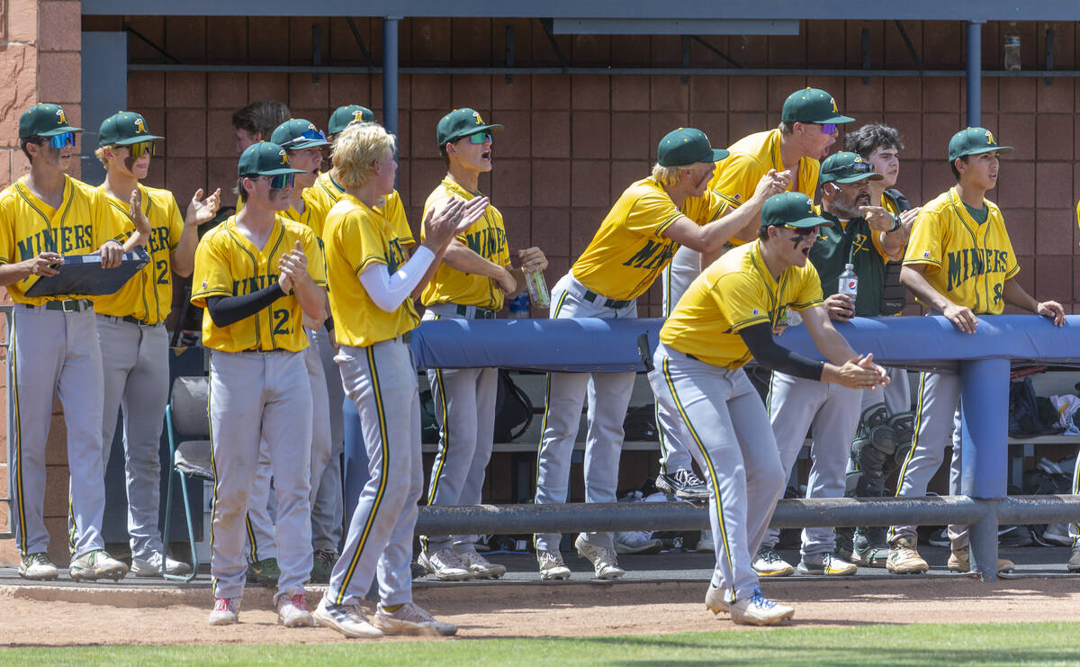 Bishop Manogue players celebrate another run over Basic during their Class 5A state baseball to ...