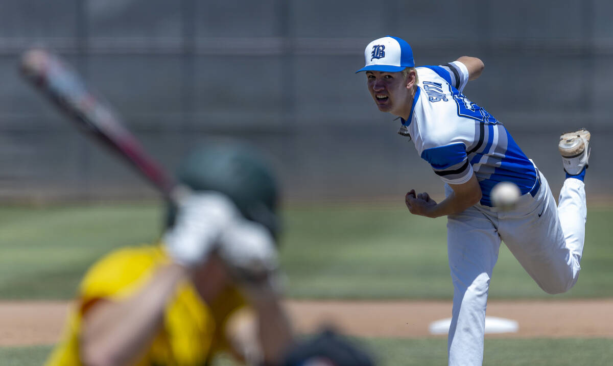 Basic pitcher Ben Smith (57) tosses another ball to the plate and a Bishop Manogue batter durin ...