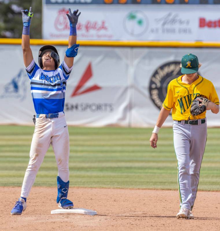 Basic runner Ty Southisene (3) arrives safe at second base over Bishop Manogue fielder Blaise C ...