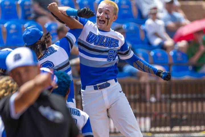 Basic batter Mason Neville (26) celebrates another score versus Bishop Manogue during their Cla ...