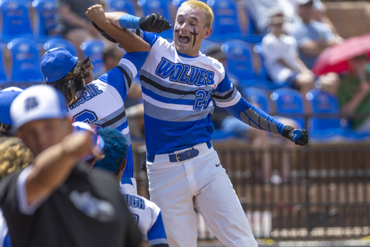 Basic batter Mason Neville (26) celebrates another score versus Bishop Manogue during their Cla ...