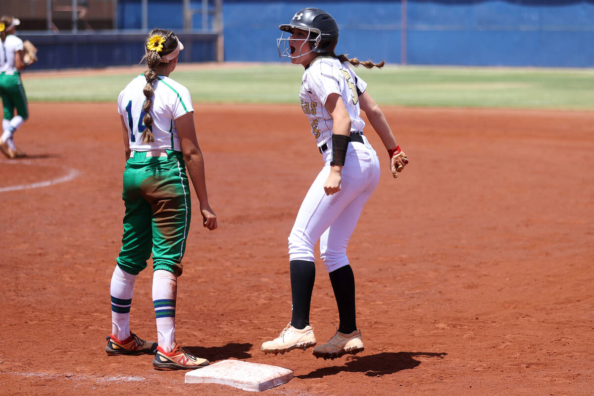 Faith Lutheran's Emily Sholeff (6) reacts after hitting the ball for a single as Green Valley's ...