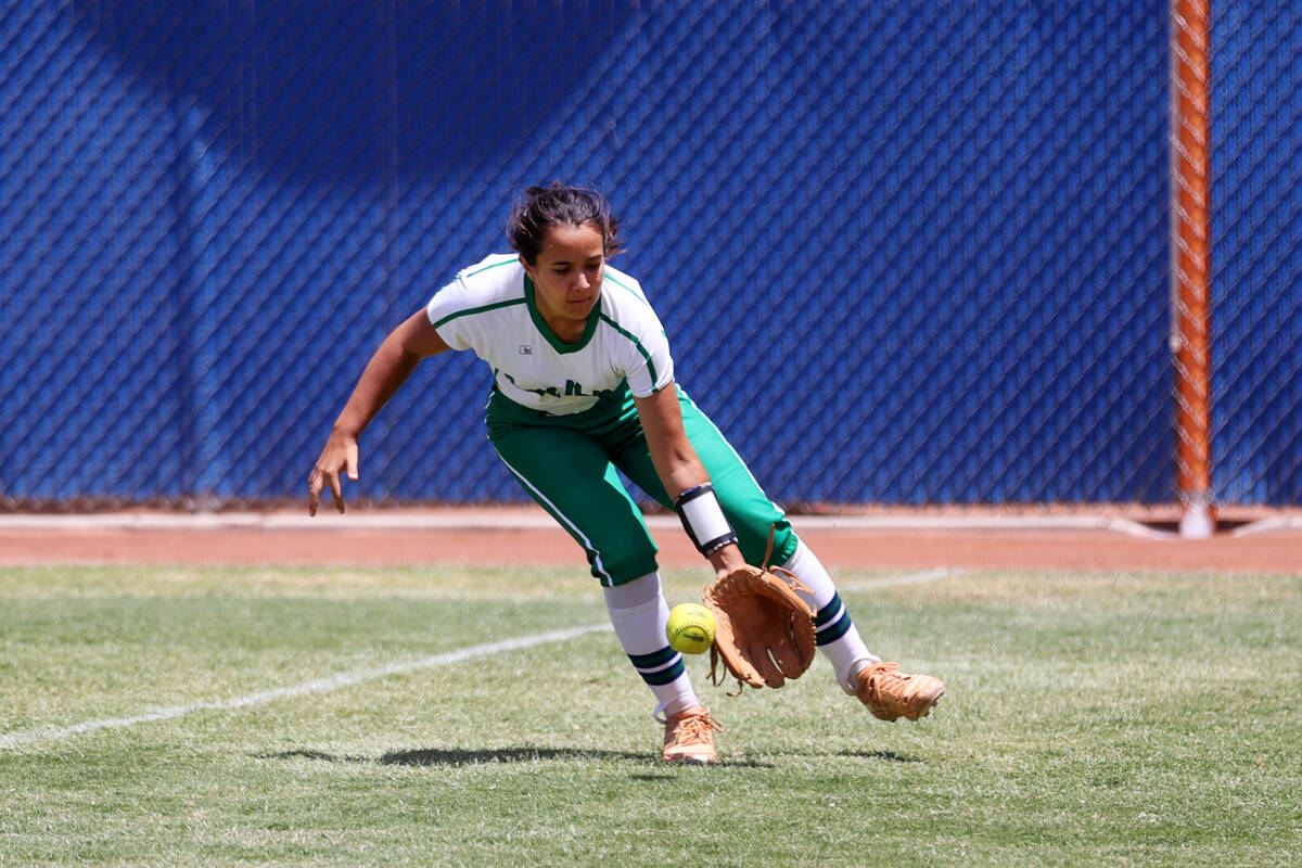 Green Valley's Hannah Watson (12) grabs a ball in the outfield for a Faith Lutheran single duri ...