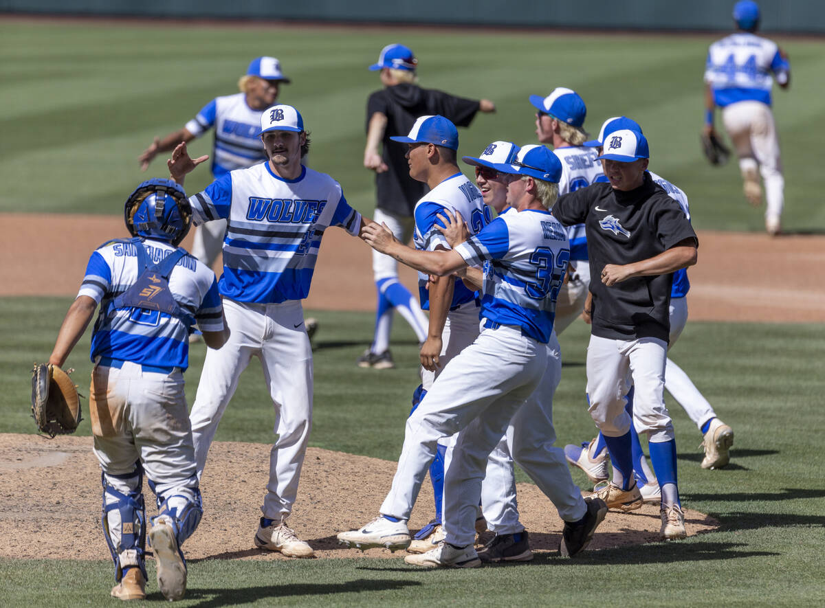 Basic players celebrate their win over Bishop Gorman 10-4 ending their Class 5A state baseball ...