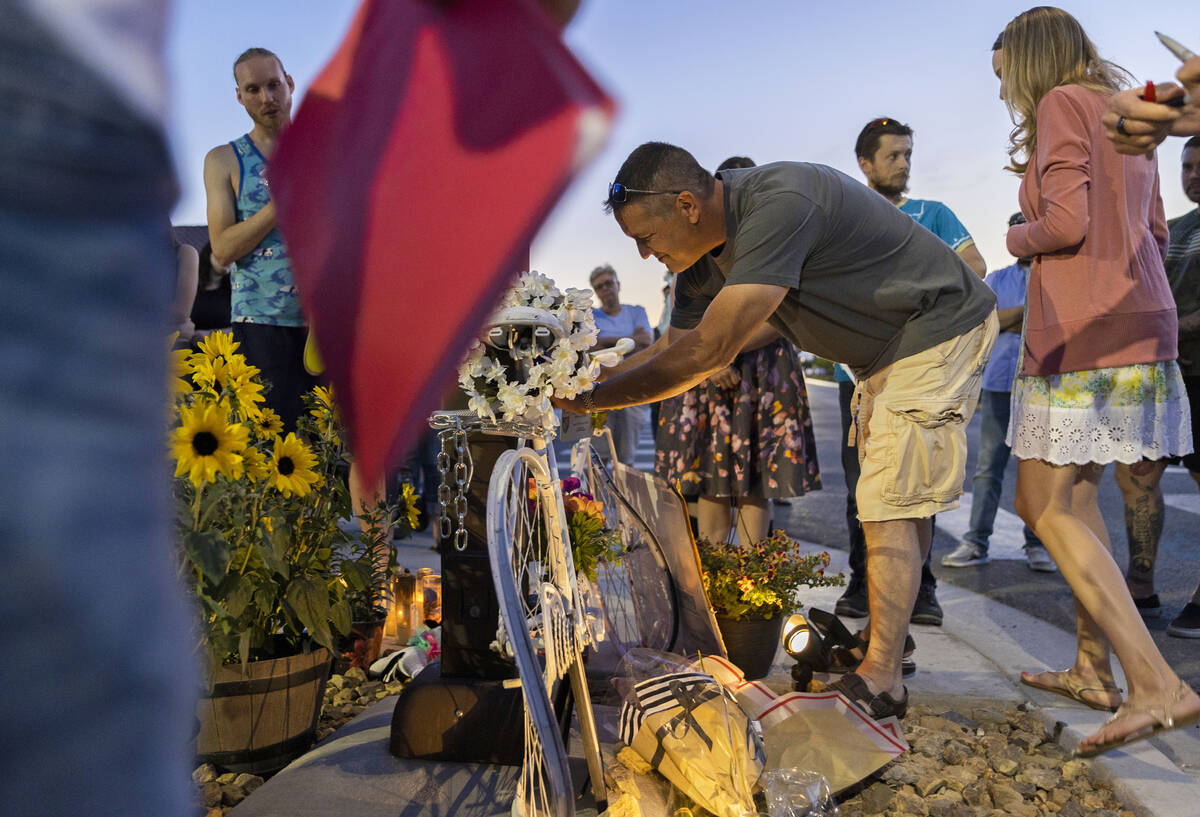 Matt Black, middle, the father of Ben Black, 31, the bicyclist killed last Sunday in North Las ...