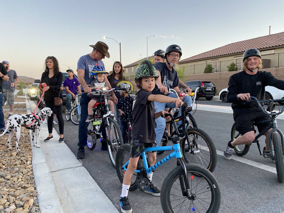 Bikers prepare for a ride around a North Las Vegas park Saturday, May 21, 2022, in honor of Ben ...