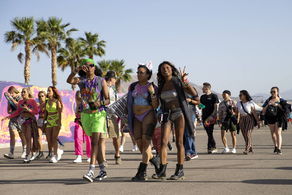 Attendees make way into the festival grounds during the first day of the Electric Daisy Carniva ...