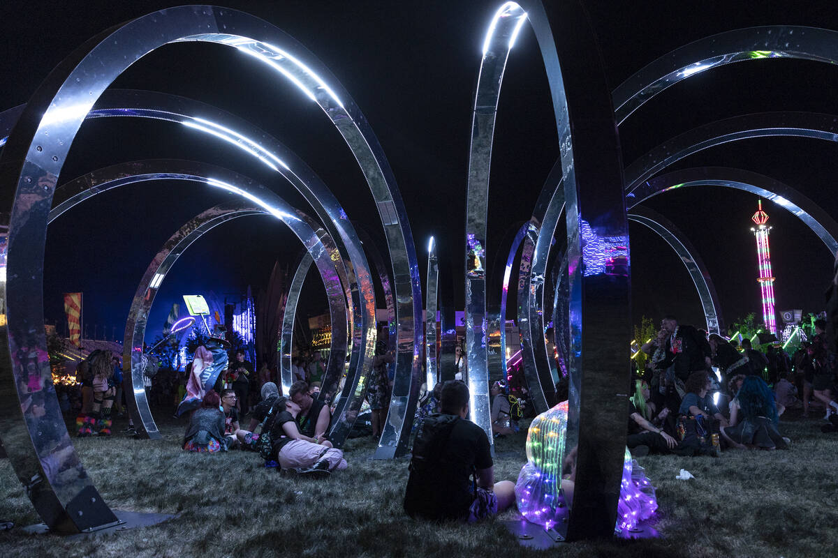 Attendees lounge in art installation “Toroid,” by This is Loop, during the first ...