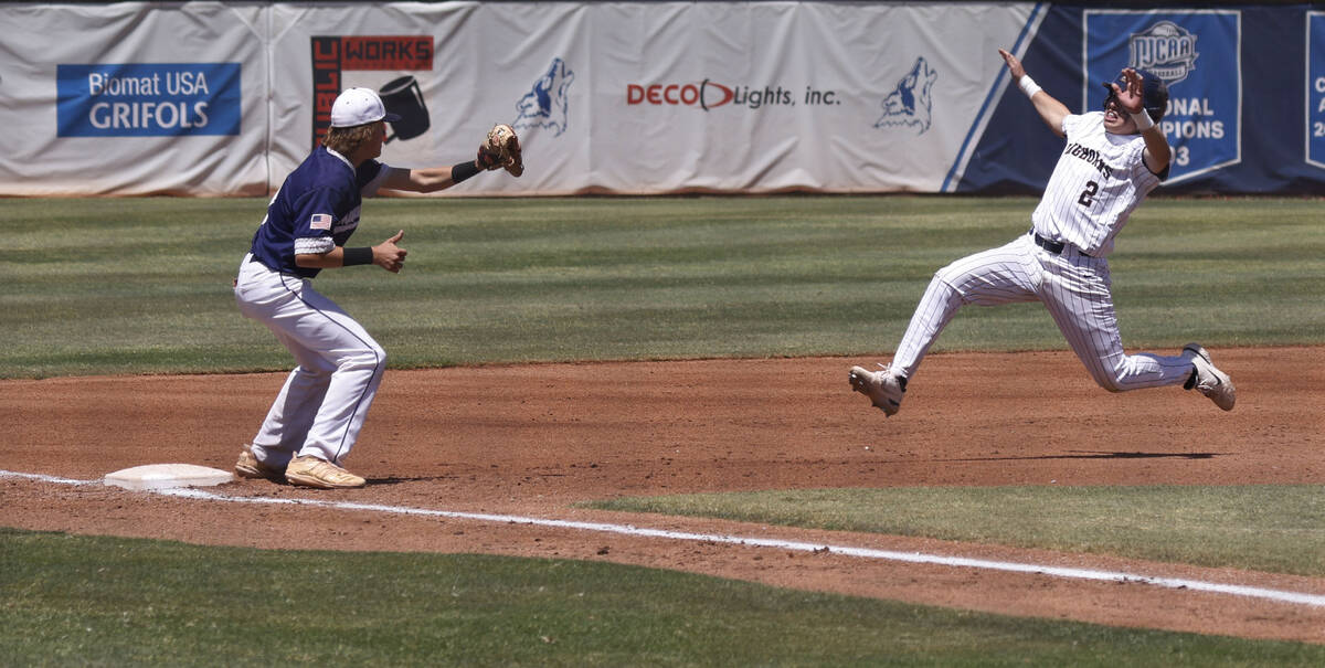 Shadow Ridge third baseman Austin Lynn, left, is ready to tag out Legacy's Oscar Pena (2) durin ...