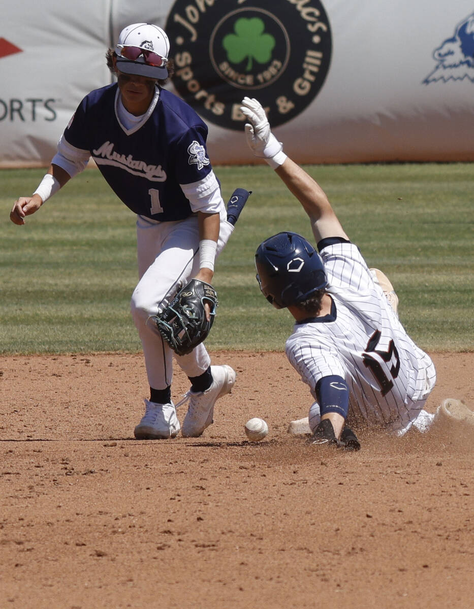 Legacy"s Colton Stanton (15) safely slides into the second base as Shadow Ridge second bas ...