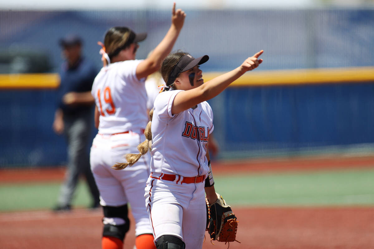 Douglas' Zora Simpson (11) gestures one out against Green Valley during the Class 5A state soft ...