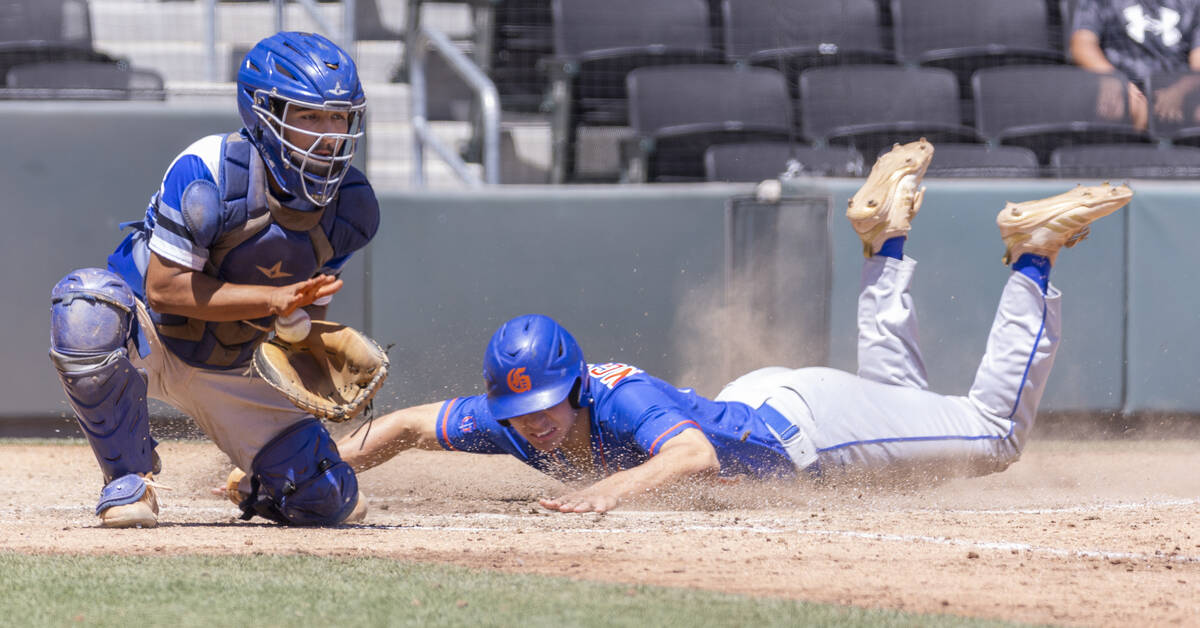 Basic catcher Alex Santiaguin (2) grabs the ball late as Bishop Gorman runner Tai Nguyen (17) s ...