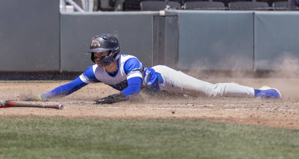 Basic runner Ty Southisene (3) scores past Bishop Gorman during their Class 5A state baseball c ...