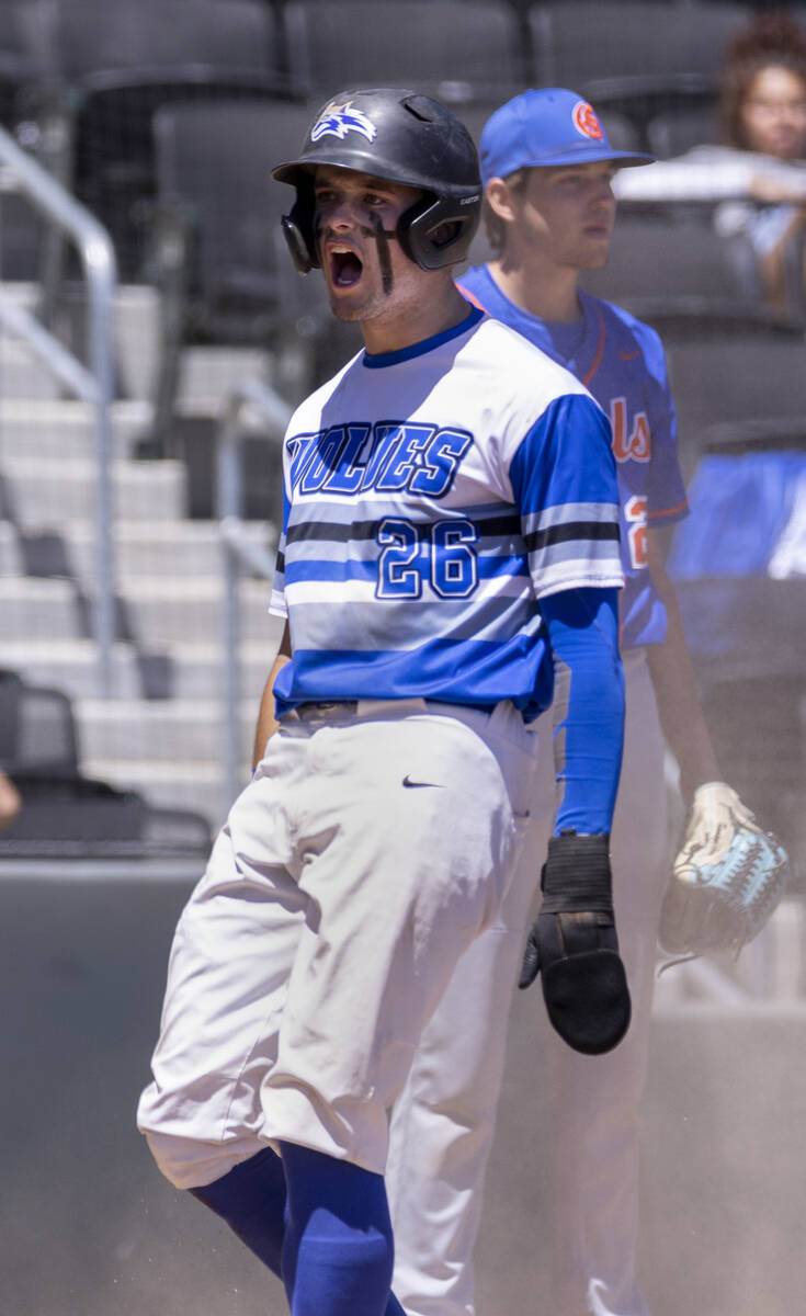 Basic runner Mason Neville (26) celebrates a score past Bishop Gorman during their Class 5A sta ...