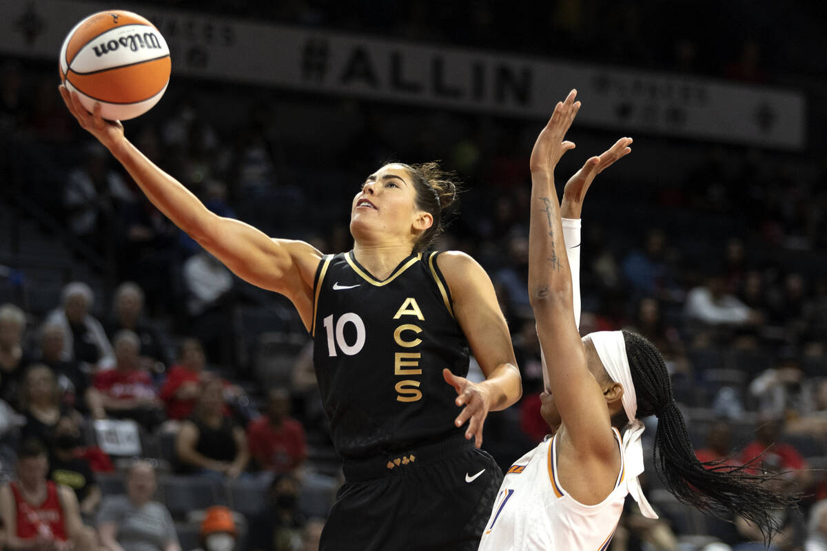 Las Vegas Aces guard Kelsey Plum (10) shoots ahead of Phoenix Mercury forward Brianna Turner (2 ...