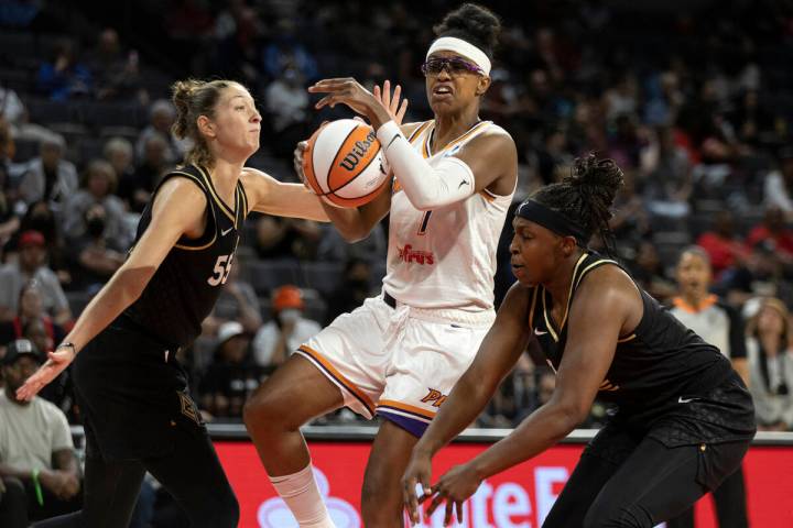 Phoenix Mercury guard Diamond DeShields (1) shoots against Las Vegas Aces forward Theresa Plais ...