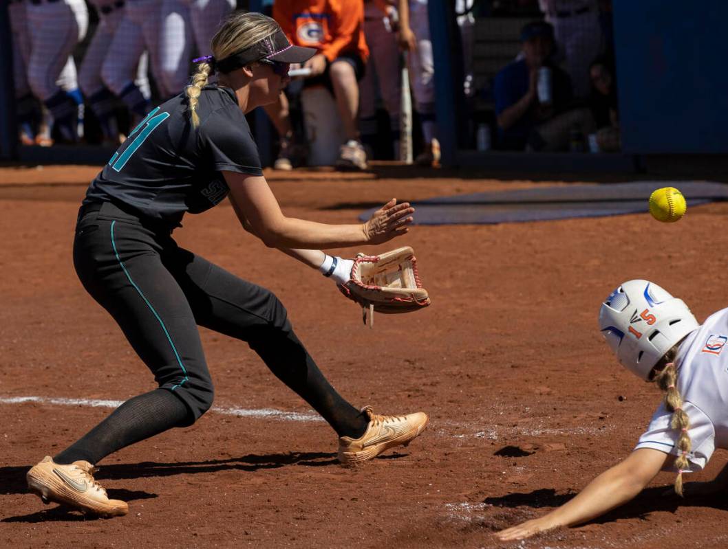 Bishop Gorman’s Lauren Sciotto (15) slides safely into home past Silverado’s Macy ...