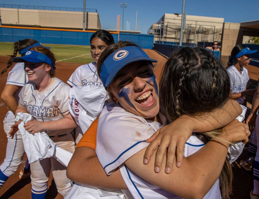 Bishop Gorman’s Lauren Sciotto, middle/facing, hugs a teammate after beating Silverado t ...