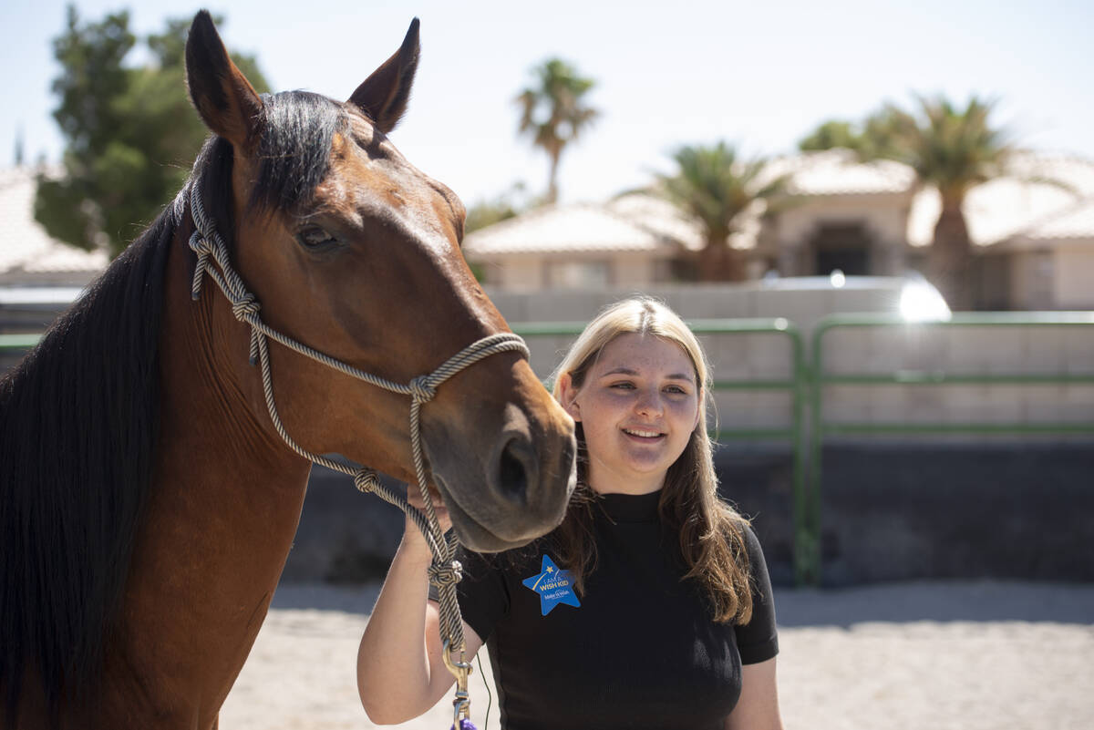 Bailey King, 17, holds her new horse Sierra while talking to reporters on Saturday, May 21, 202 ...