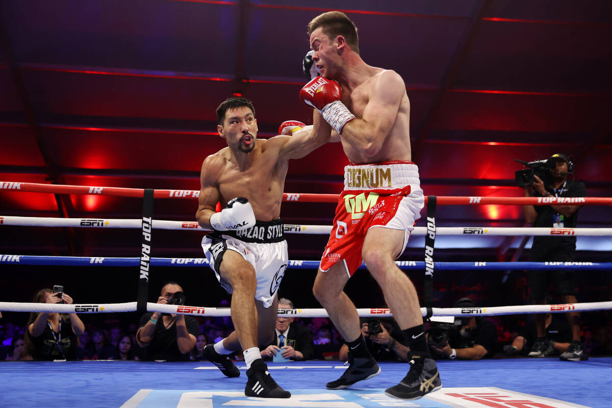 Janibek Alimkhanuly, left, connects a punch against Danny Dignum in the second round of the WBO ...