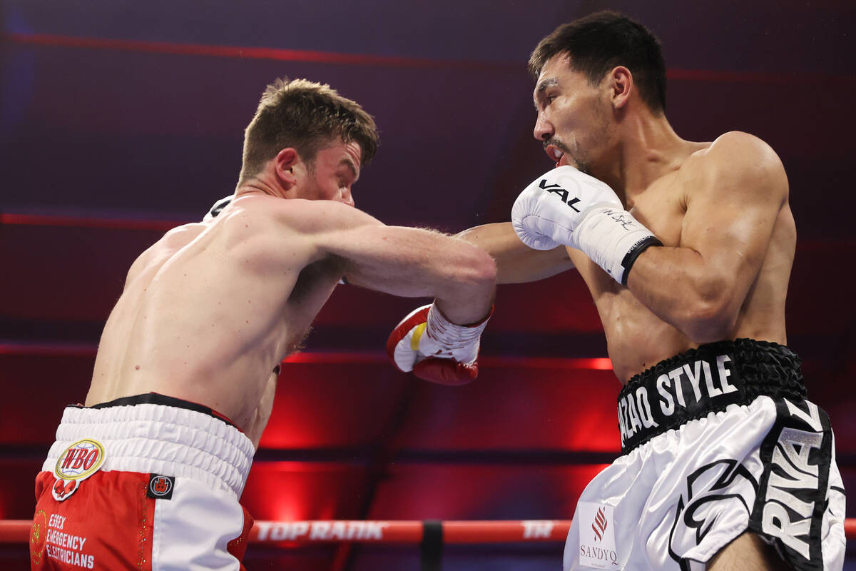 Janibek Alimkhanuly, right, connects a punch against Danny Dignum in the second round of the WB ...