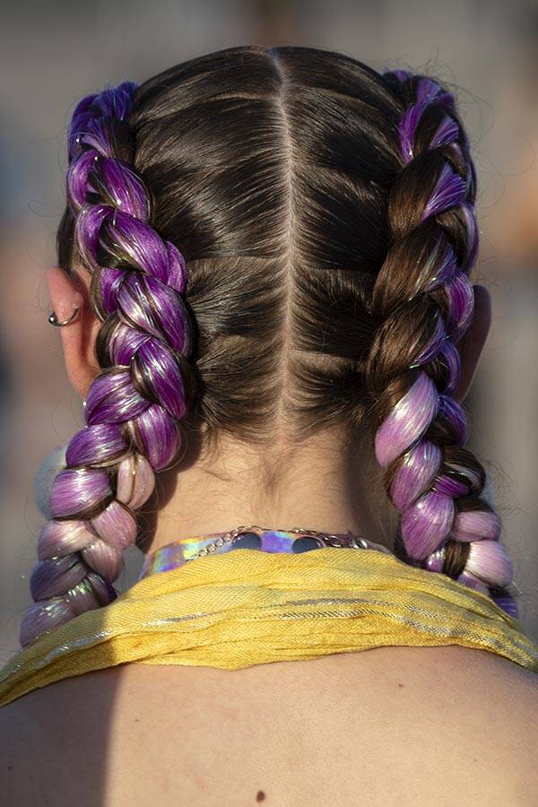 An attendee wears dyed French braids to the second day of the Electric Daisy Carnival at the La ...