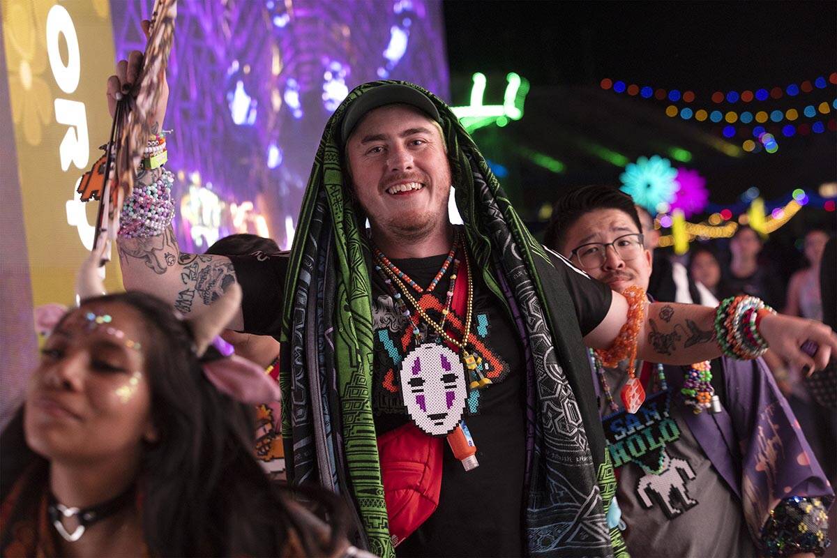 Attendees dance through Memory Lane during the second day of the Electric Daisy Carnival at the ...
