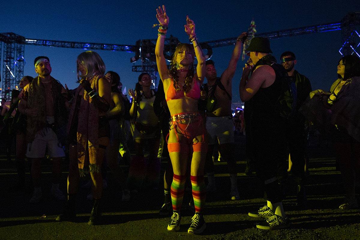 Attendees dance throughout the electronic music festival grounds during the second day of the E ...