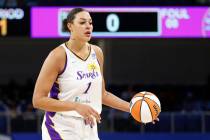 Los Angeles Sparks center Liz Cambage brings the ball up court against the Chicago Sky during t ...