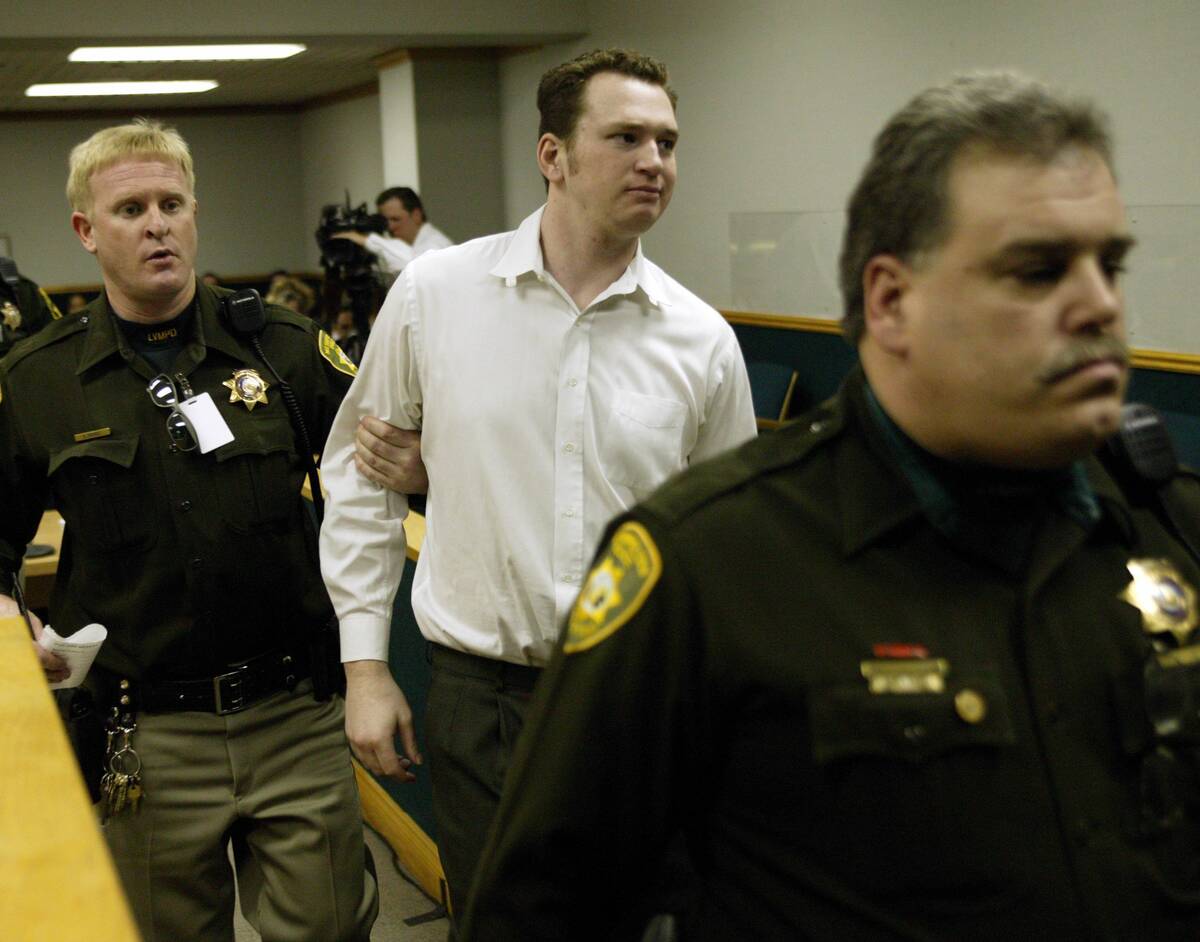 Las Vegas Metropolitan Police officers escorts Timmy "T.J." Weber from court after he ...