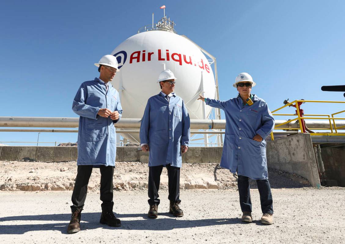 Plant engineer Hannah Nelson, right, talks about the liquid hydrogen storage sphere alongside M ...