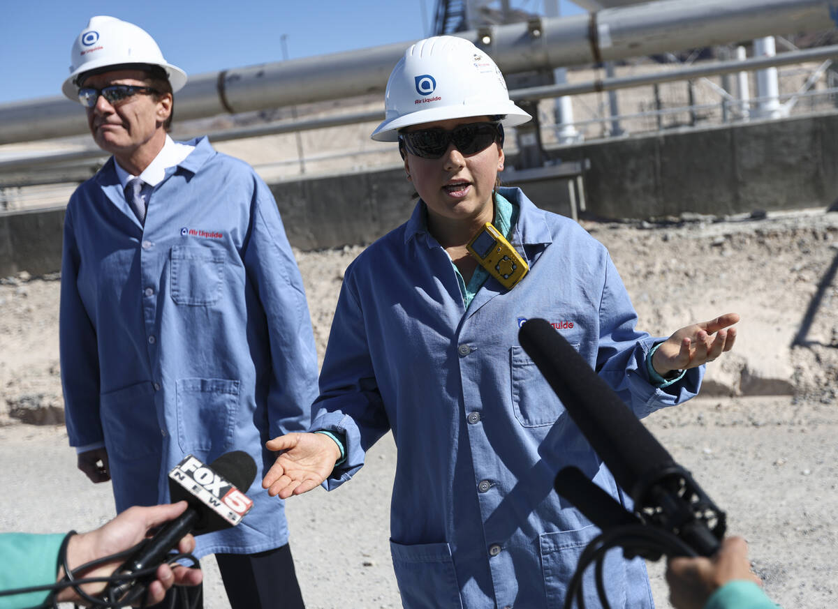 Plant engineer Hannah Nelson, right, talks about the liquid hydrogen storage sphere during a to ...